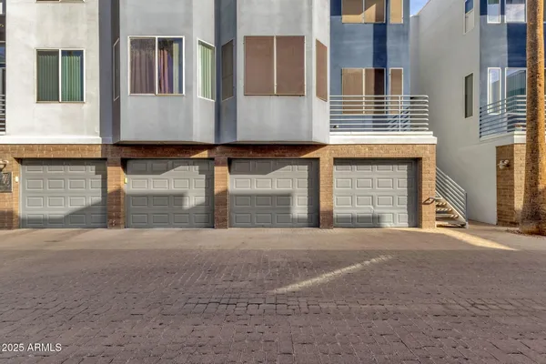 a view of a house with a street