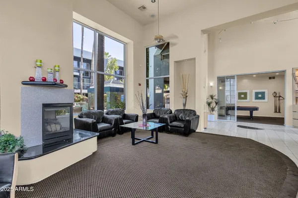 a living room with furniture and a fireplace