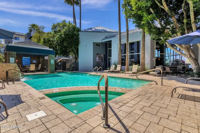 a front view of a house with a yard table and chairs