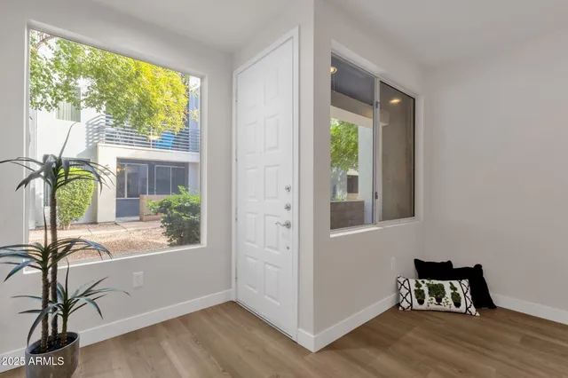 a view of workspace with furniture and windows