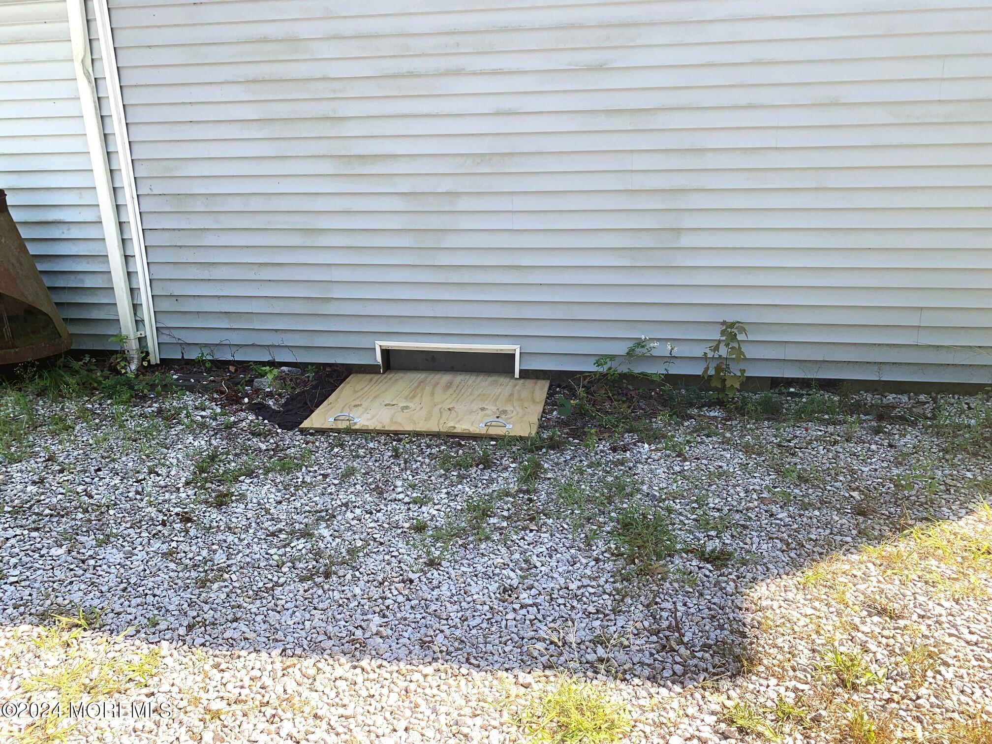 696 Wright Debow Road Jackson, NJ 08527 - Photo 29 of 31 a view of a backyard with plants and white umbrella