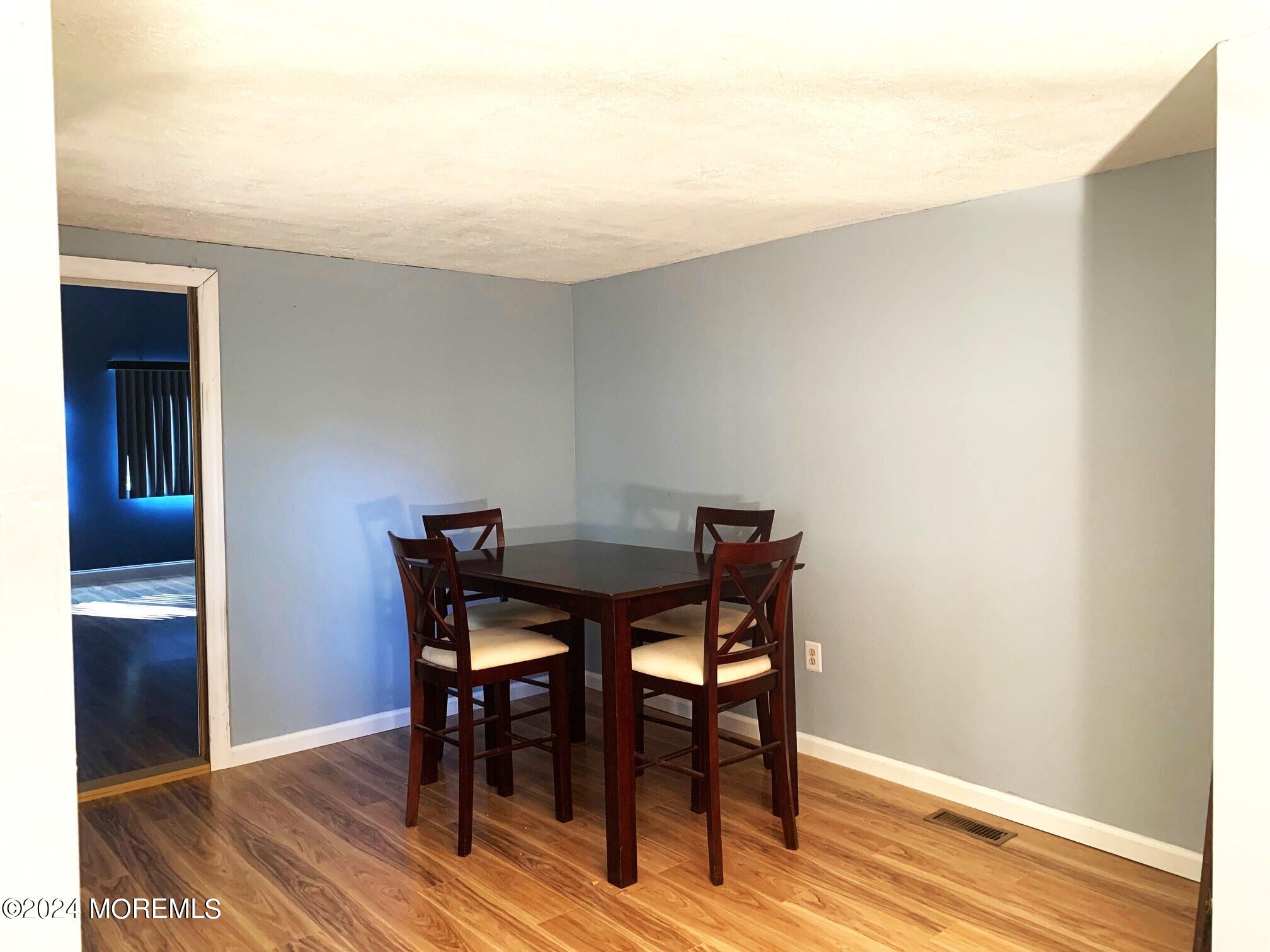 696 Wright Debow Road Jackson, NJ 08527 - Photo 8 of 31 a view of a dining room with furniture and wooden floor
