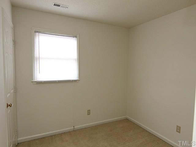 8201 Bellingham Circle Raleigh, NC 27615 - Photo 19 of 22 an empty room with a window