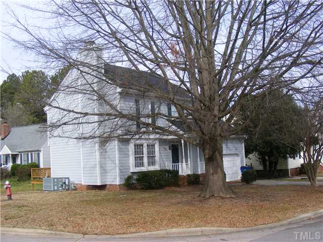 8201 Bellingham Circle Raleigh, NC 27615 - Photo 4 of 22 a front view of a house with a yard