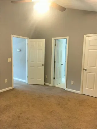 an empty room with closet area