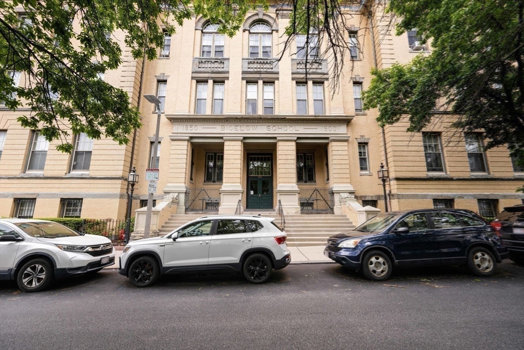 350 West Fourth Street, Unit 103 Boston, MA 02127 - Photo 32 of 33 a view of a cars parked in front of a house