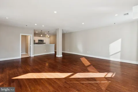 a view of a kitchen with a sink and an oven