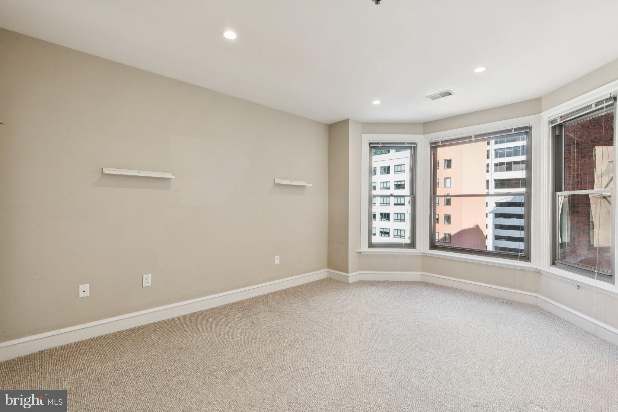 1811 Chestnut Street, Unit 701 Philadelphia, PA 19103 - Photo 19 of 26 a view of an empty room with a window