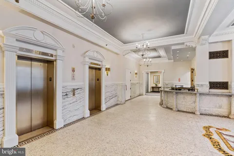 a large kitchen with cabinets and stainless steel appliances