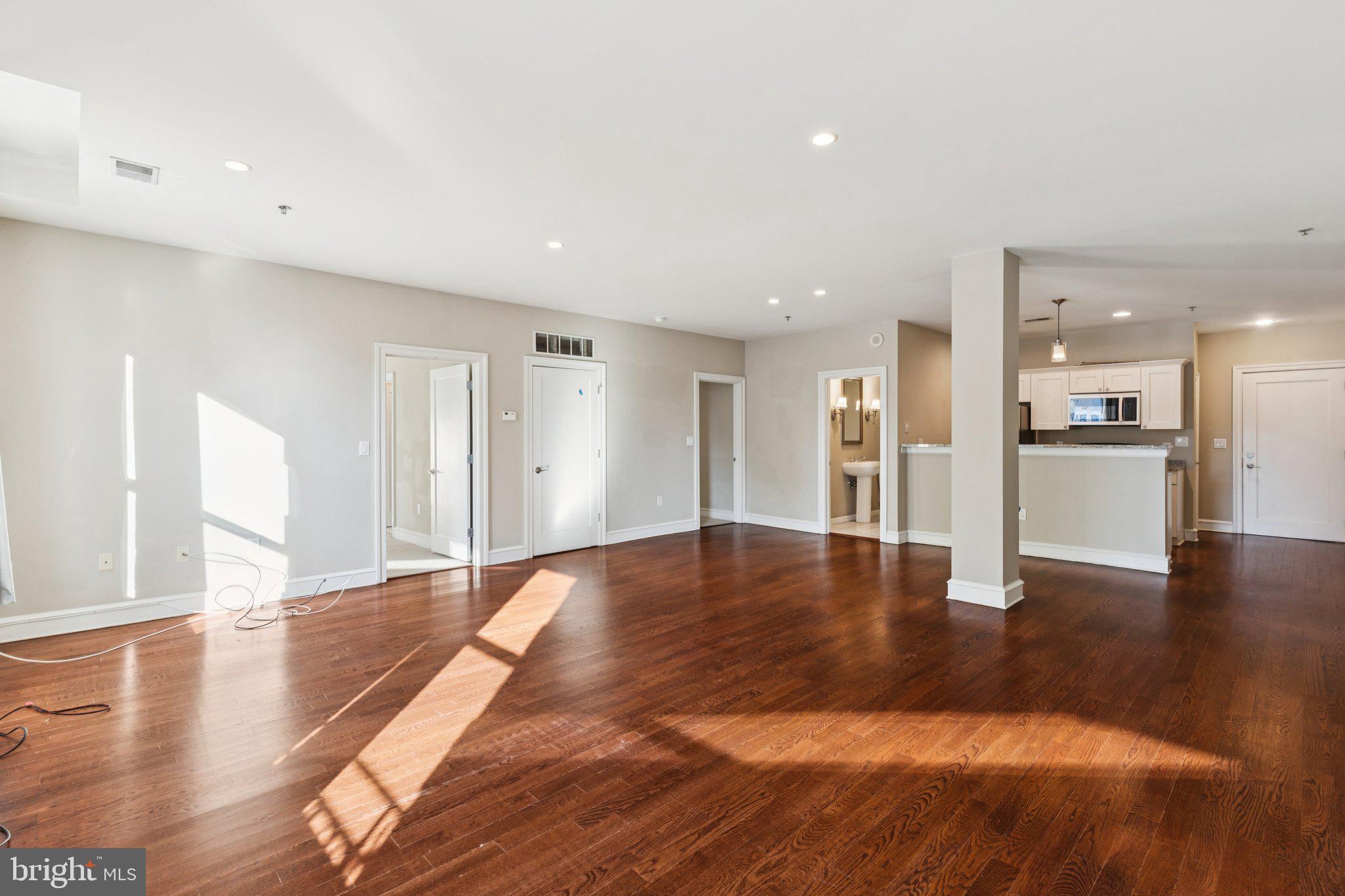1811 Chestnut Street, Unit 701 Philadelphia, PA 19103 - Photo 9 of 26 a view of a kitchen with a sink and a stove