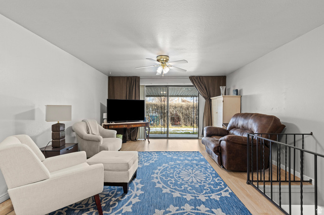 320 North 150 West Logan, UT 84321 - Photo 4 of 22 Living room featuring wood finished floors and ceiling fan
