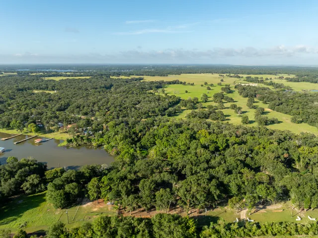 an aerial view of beach and building
