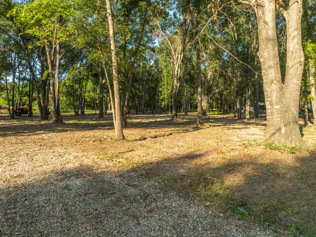 a swimming pool with outdoor seating and yard