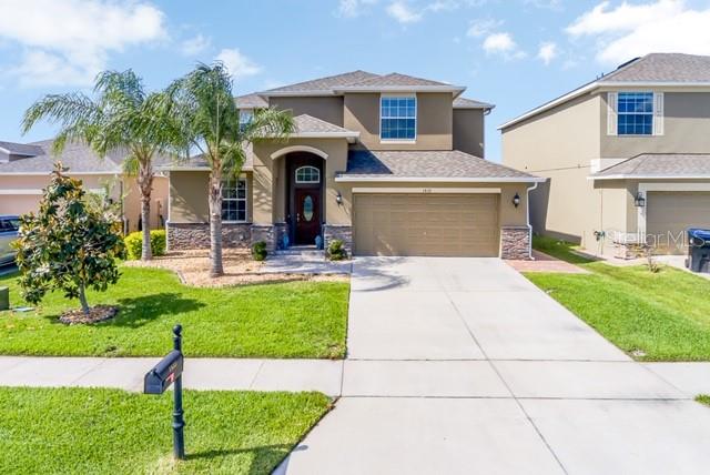 1833 Penrith Loop, Unit 6 Orlando, FL 32824 - Photo 1 of 1 a front view of a house with garden