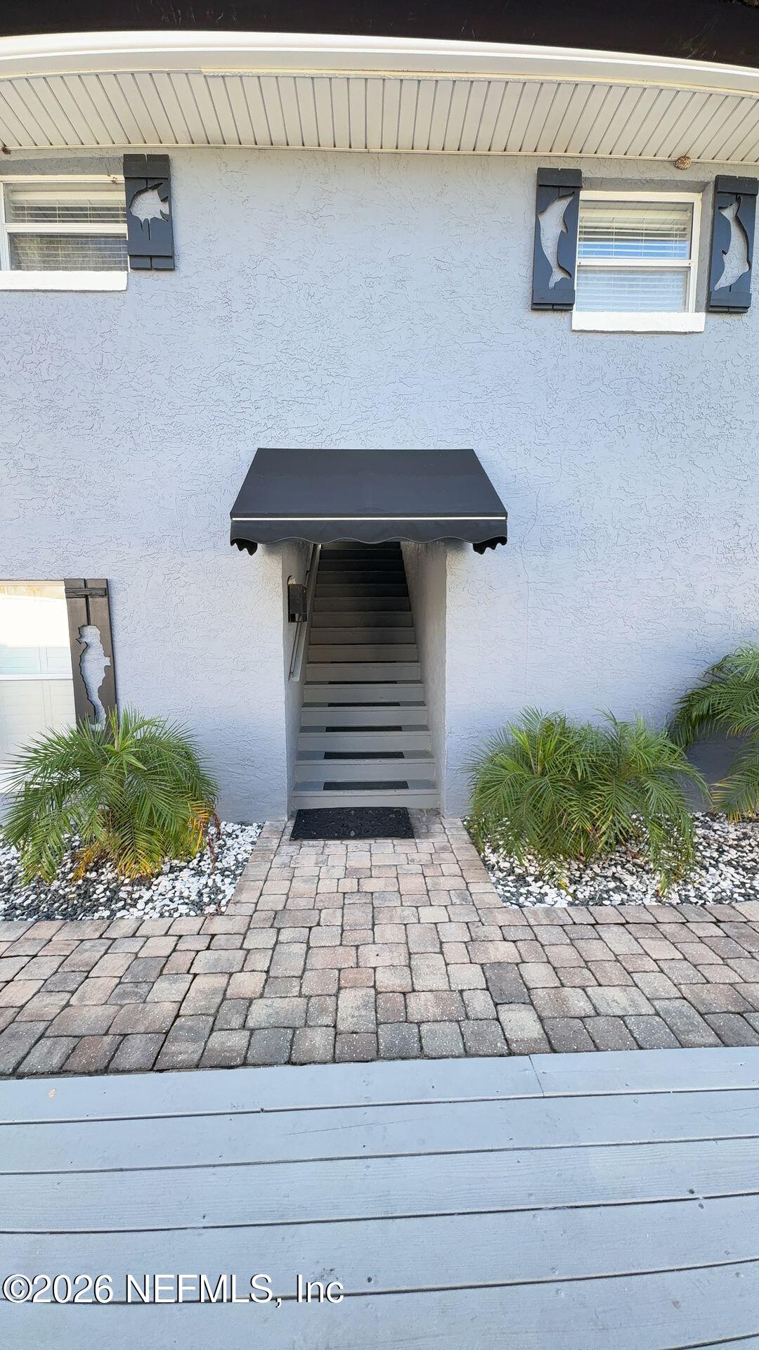 108 South 5th Street, Unit 2B Flagler Beach, FL 32136 - Photo 1 of 14 a front view of a house with windows