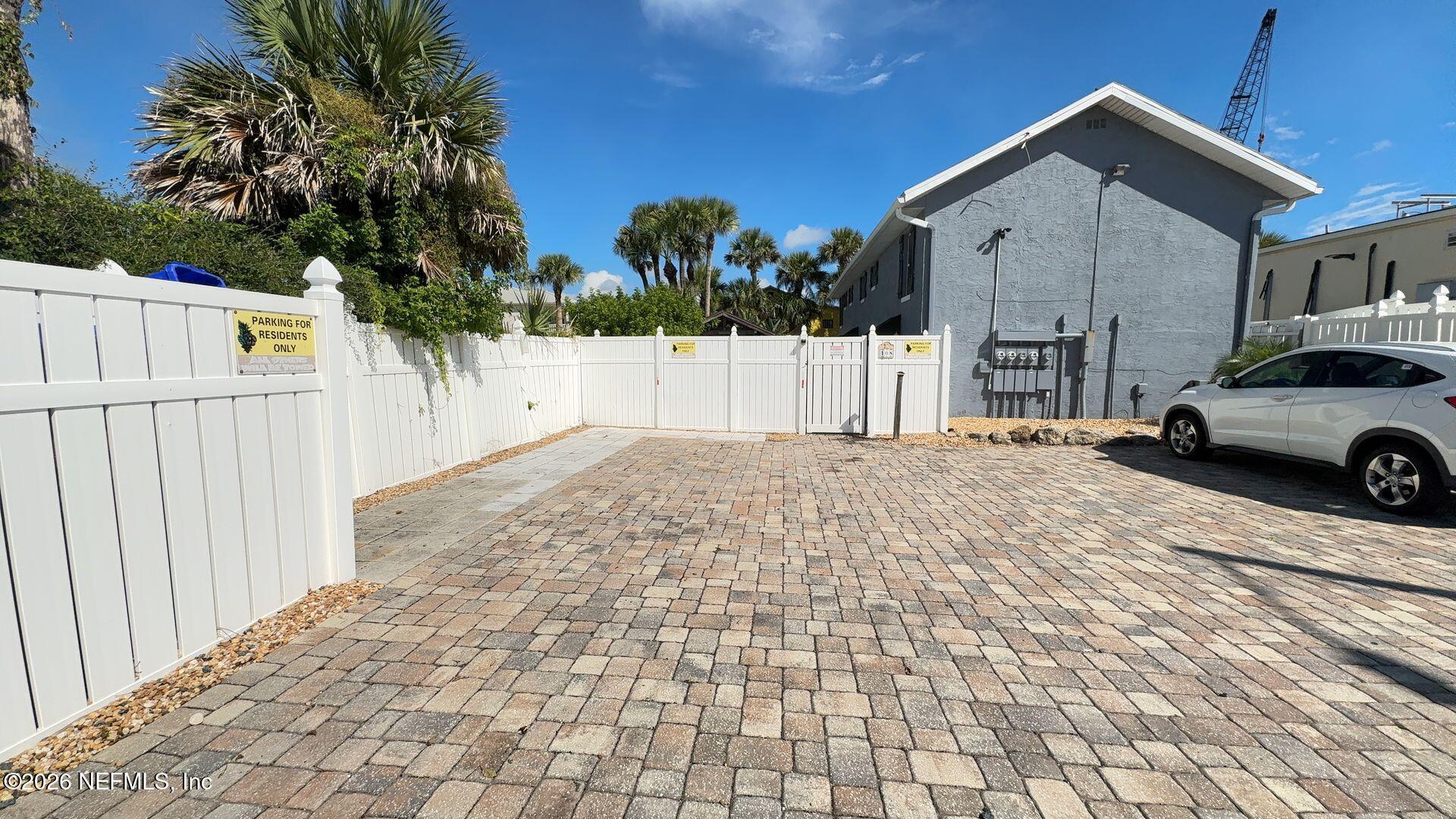 108 South 5th Street, Unit 2B Flagler Beach, FL 32136 - Photo 5 of 14 a view of a car park in front of house