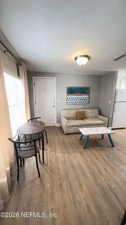 a living room with furniture and a table