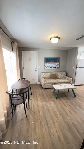 a living room with furniture and a table