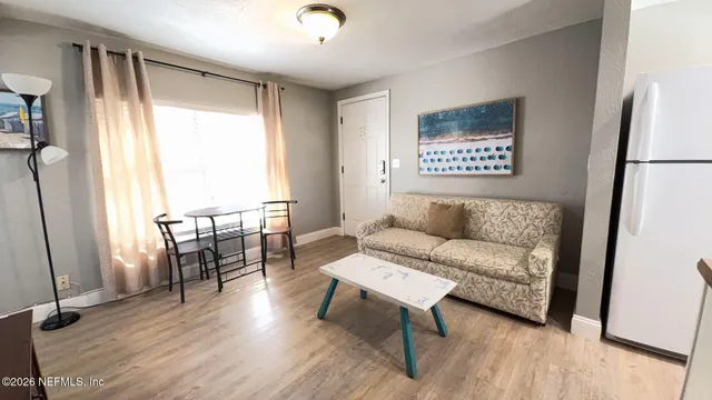 a living room with furniture and a table