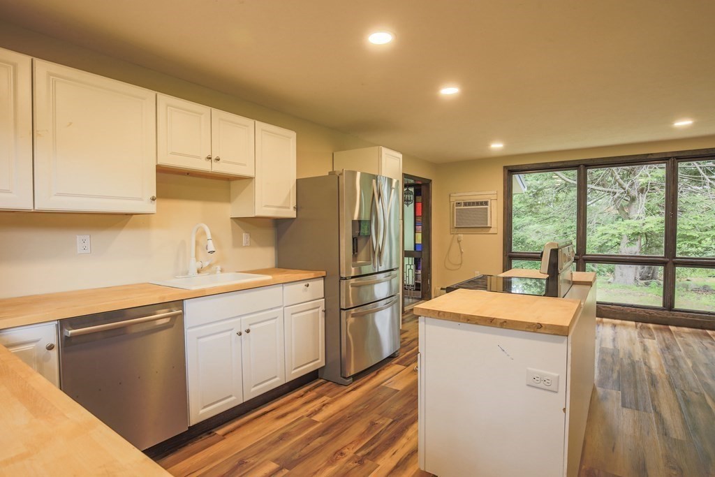 16 Bypass Road Lincoln, MA 01773 - Photo 8 of 31 a kitchen that has a sink stainless steel appliances a counter space and a window