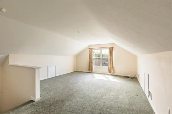 a spacious bathroom with a double vanity sink and a mirror