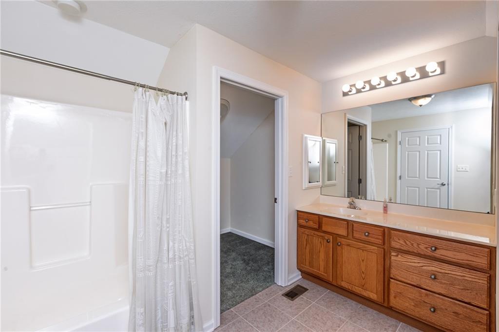 1153 Cobblestone Lane Valencia, PA 16059 - Photo 16 of 27 a spacious bathroom with a double vanity sink and a mirror