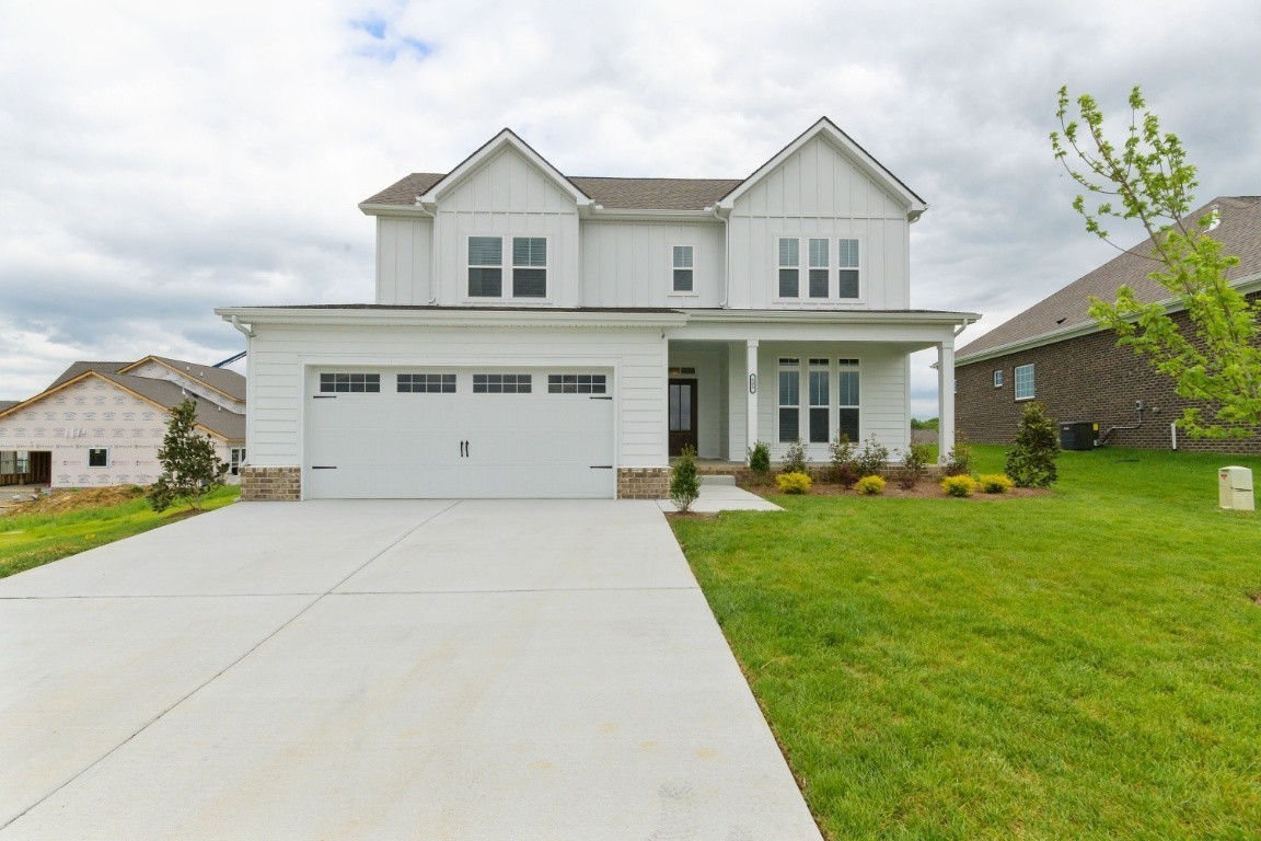 626 Castle Road Mount Juliet, TN 37122 - Photo 1 of 29 a front view of a house with a yard and potted plants