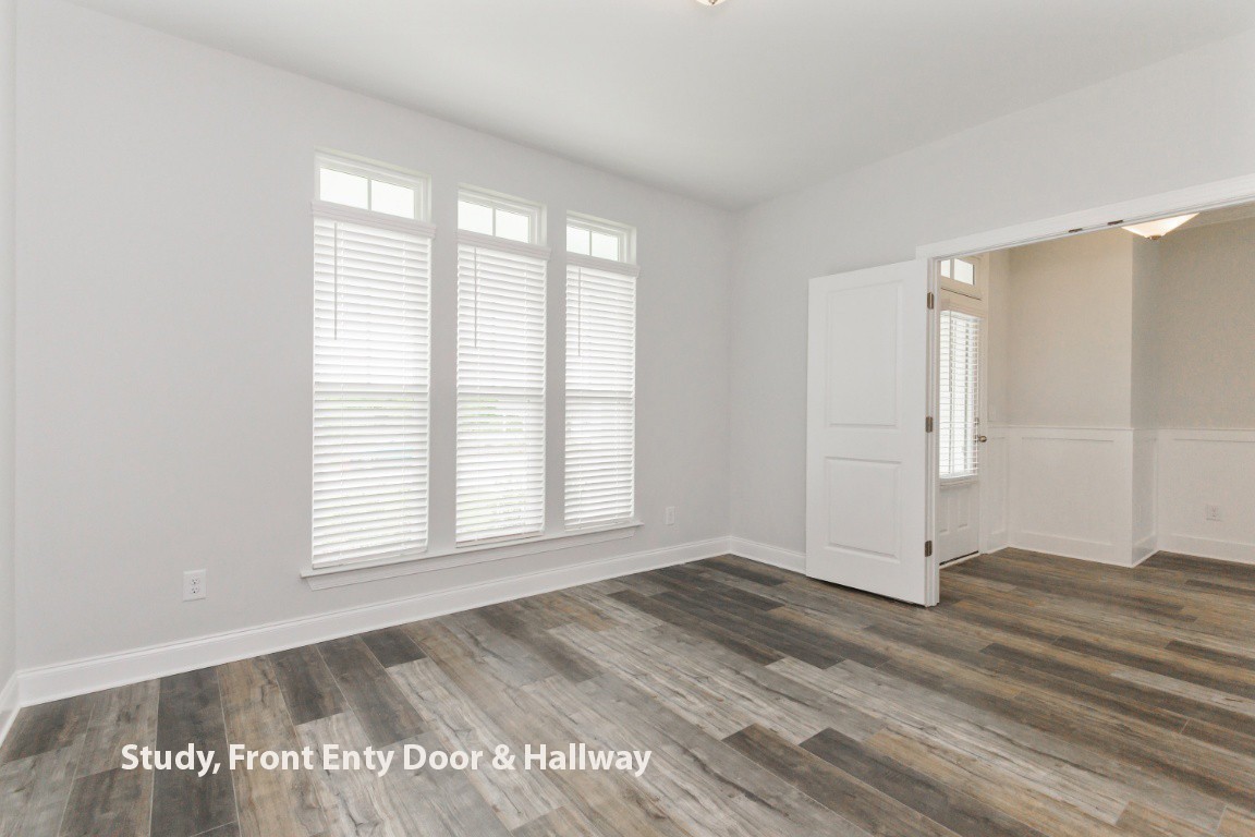 626 Castle Road Mount Juliet, TN 37122 - Photo 4 of 29 an empty room with wooden floor and windows