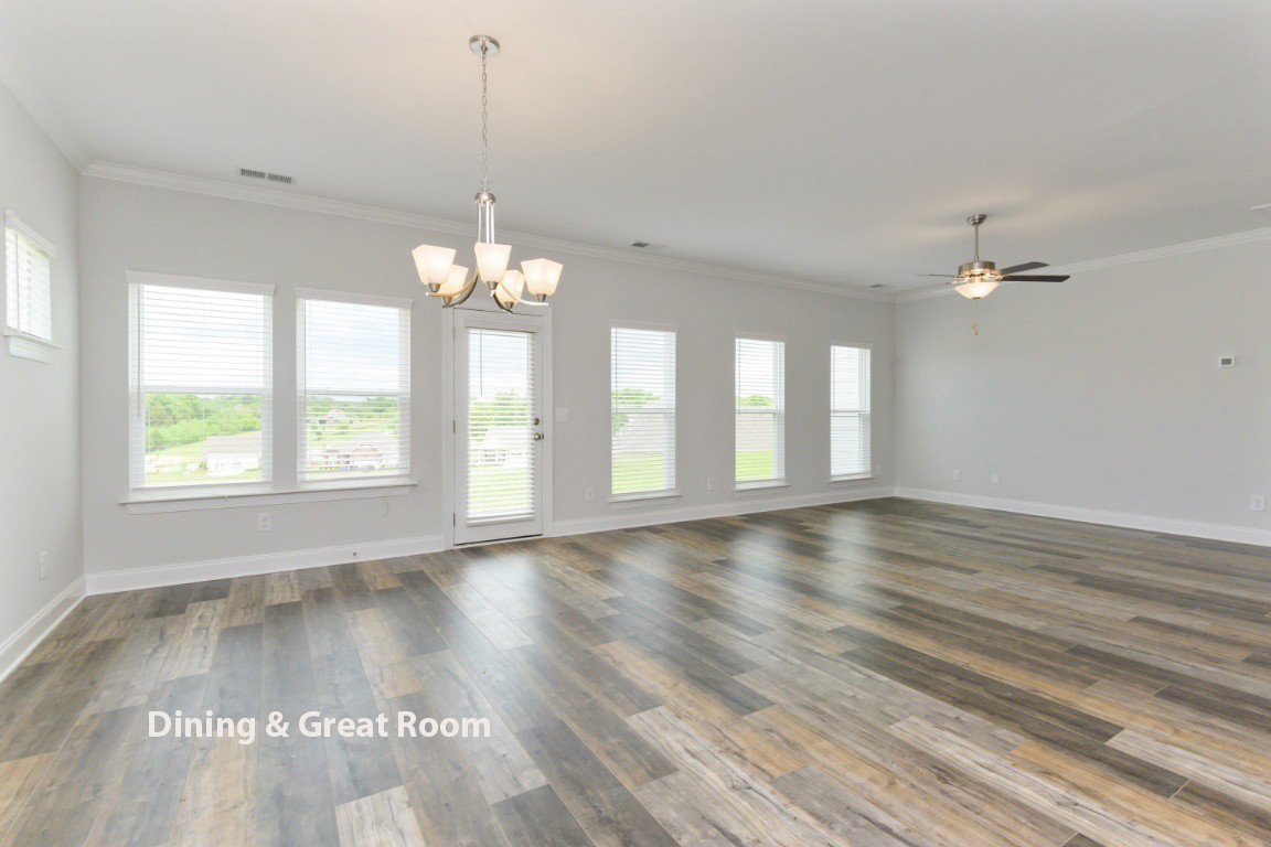 626 Castle Road Mount Juliet, TN 37122 - Photo 10 of 29 a view of an empty room with wooden floor and a window