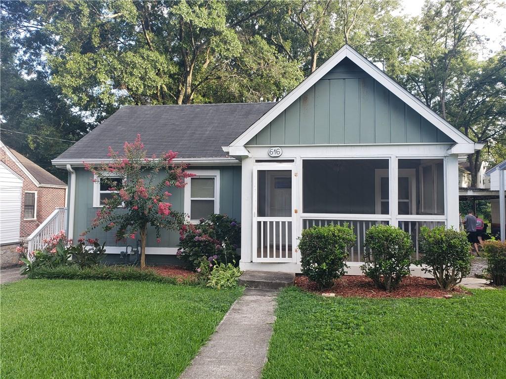 616 Spring Street Hapeville, GA 30354 - Photo 1 of 1 a view of a house with a yard and plants