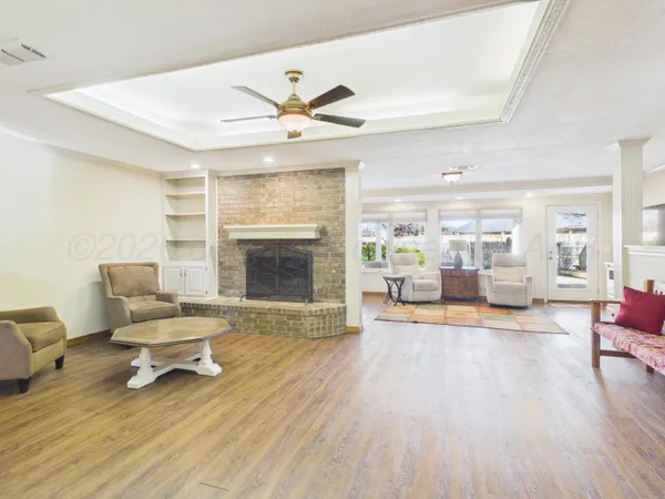 a living room with furniture and a fireplace
