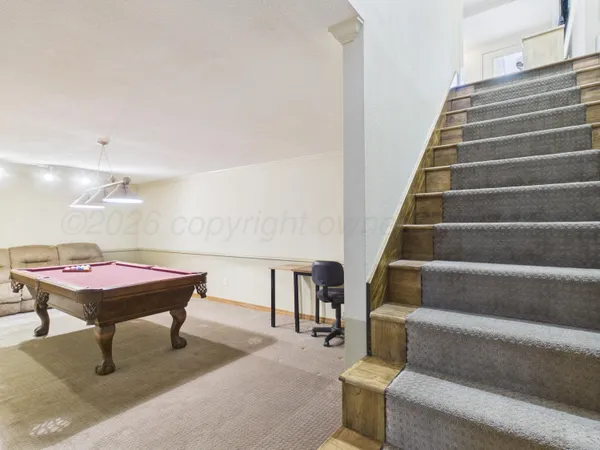 a room with furniture and stairs