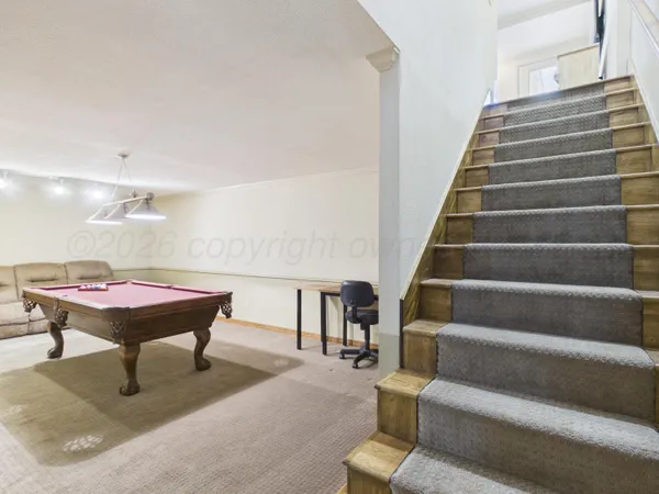 a room with furniture and stairs