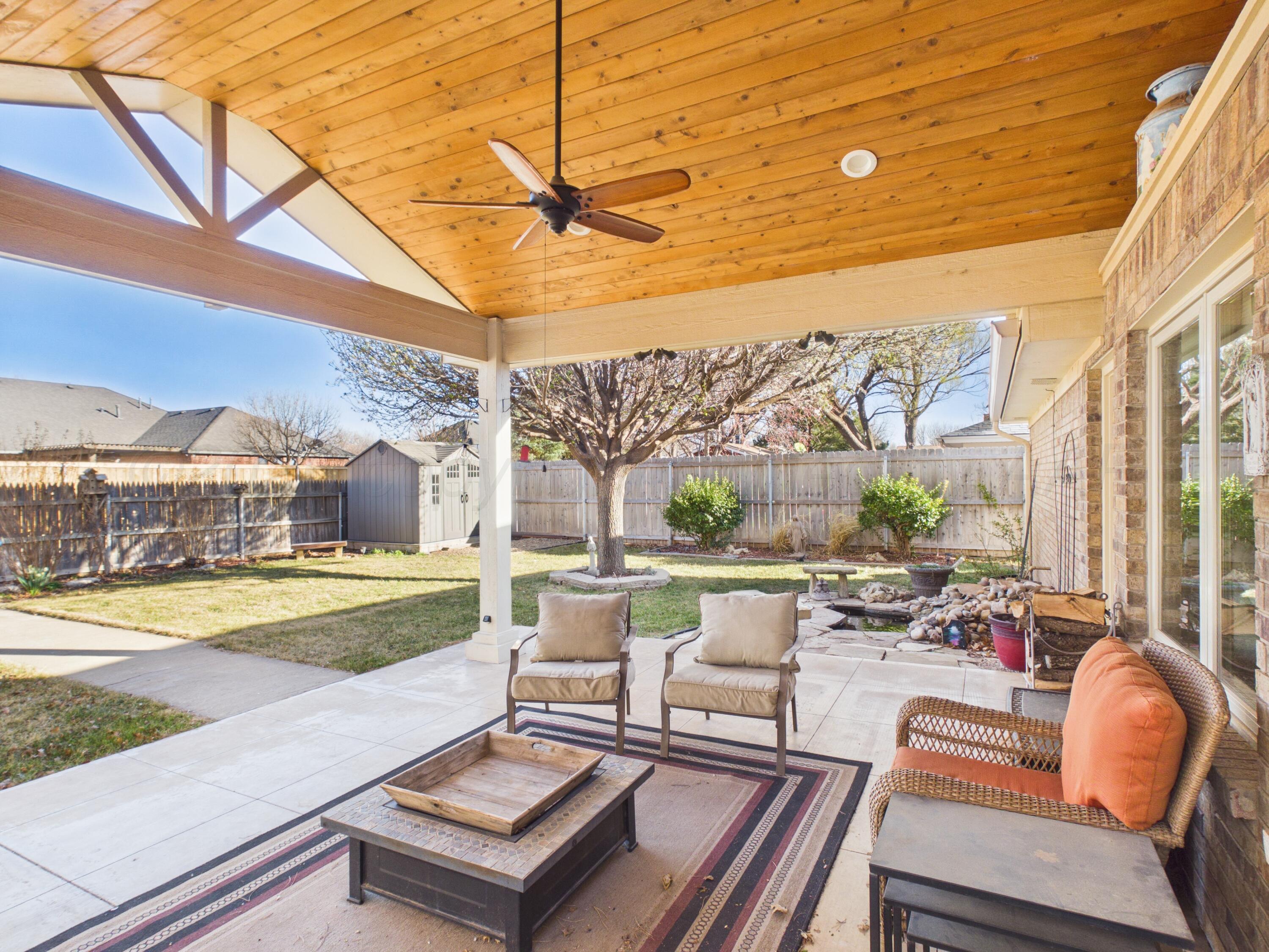 506 Robin Road Dumas, TX 79029 - Photo 23 of 31 a view of a patio with couches chairs and a table and chairs