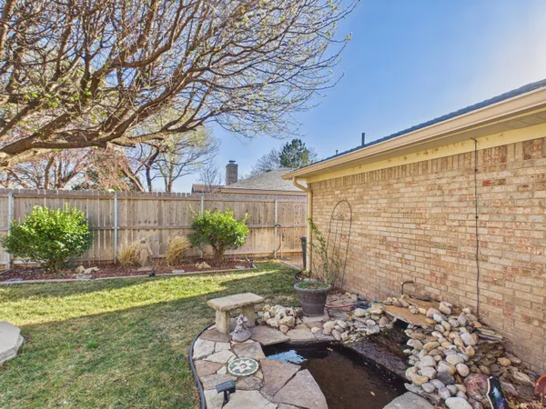 a view of backyard with patio