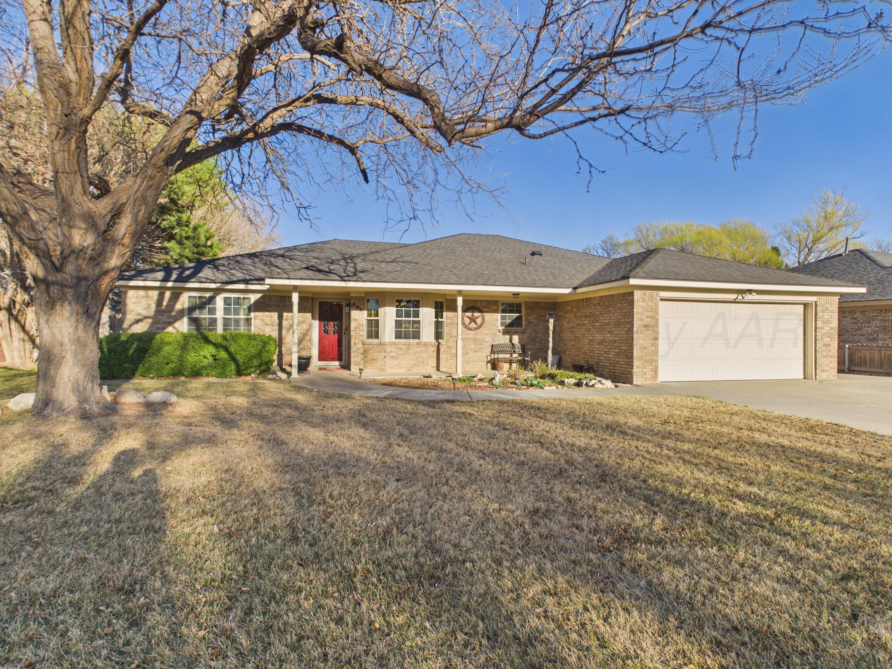 506 Robin Road Dumas, TX 79029 - Photo 31 of 31 a view of house with outdoor space and a car parked in front of it