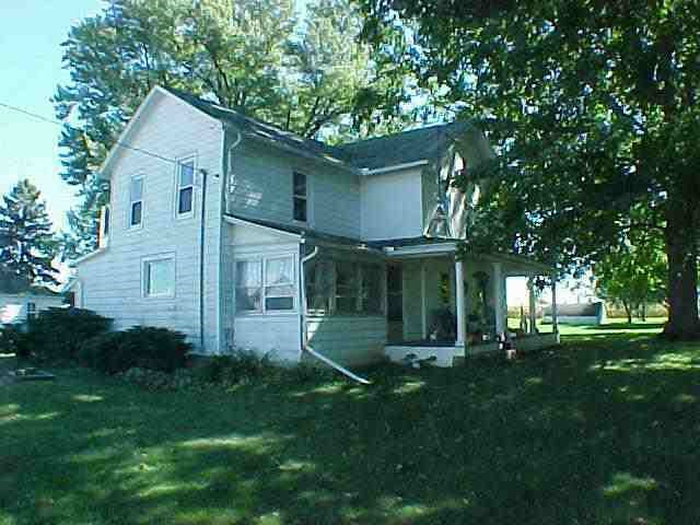 3897 North Rink Road Lena, IL 61048 - Photo 1 of 6 a front view of a house with a garden