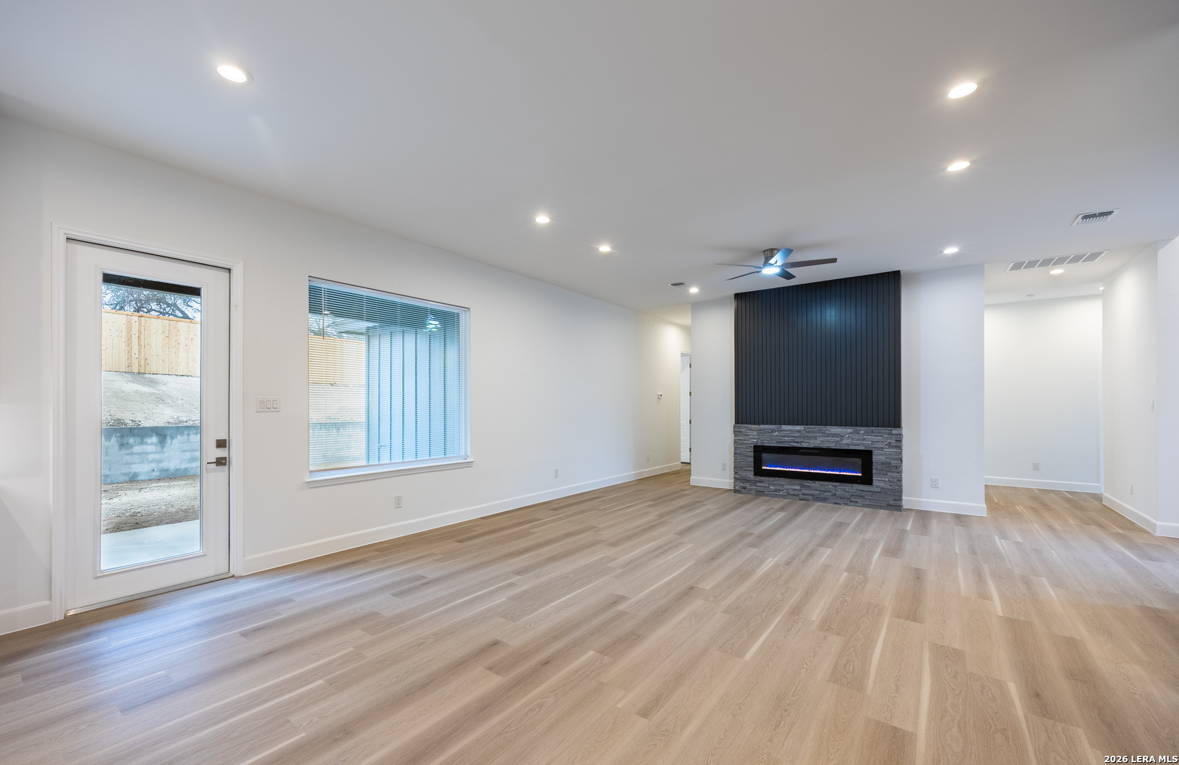 8221 Old Austin Road Selma, TX 78154 - Photo 11 of 28 a view of room with wooden floor and flat screen tv