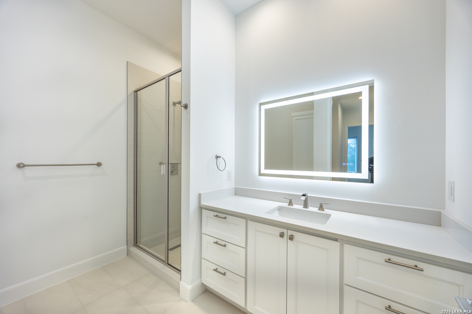 8221 Old Austin Road Selma, TX 78154 - Photo 18 of 28 a bathroom with a shower sink and mirror