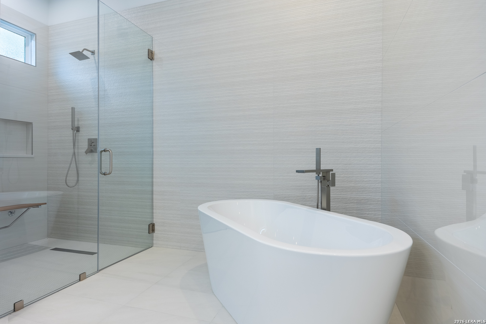 8221 Old Austin Road Selma, TX 78154 - Photo 21 of 28 a white bath tub sitting next to a white toilet