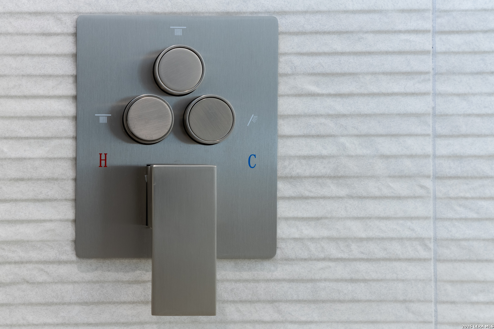 8221 Old Austin Road Selma, TX 78154 - Photo 24 of 28 a picture of a bathroom with a shower and a mirror