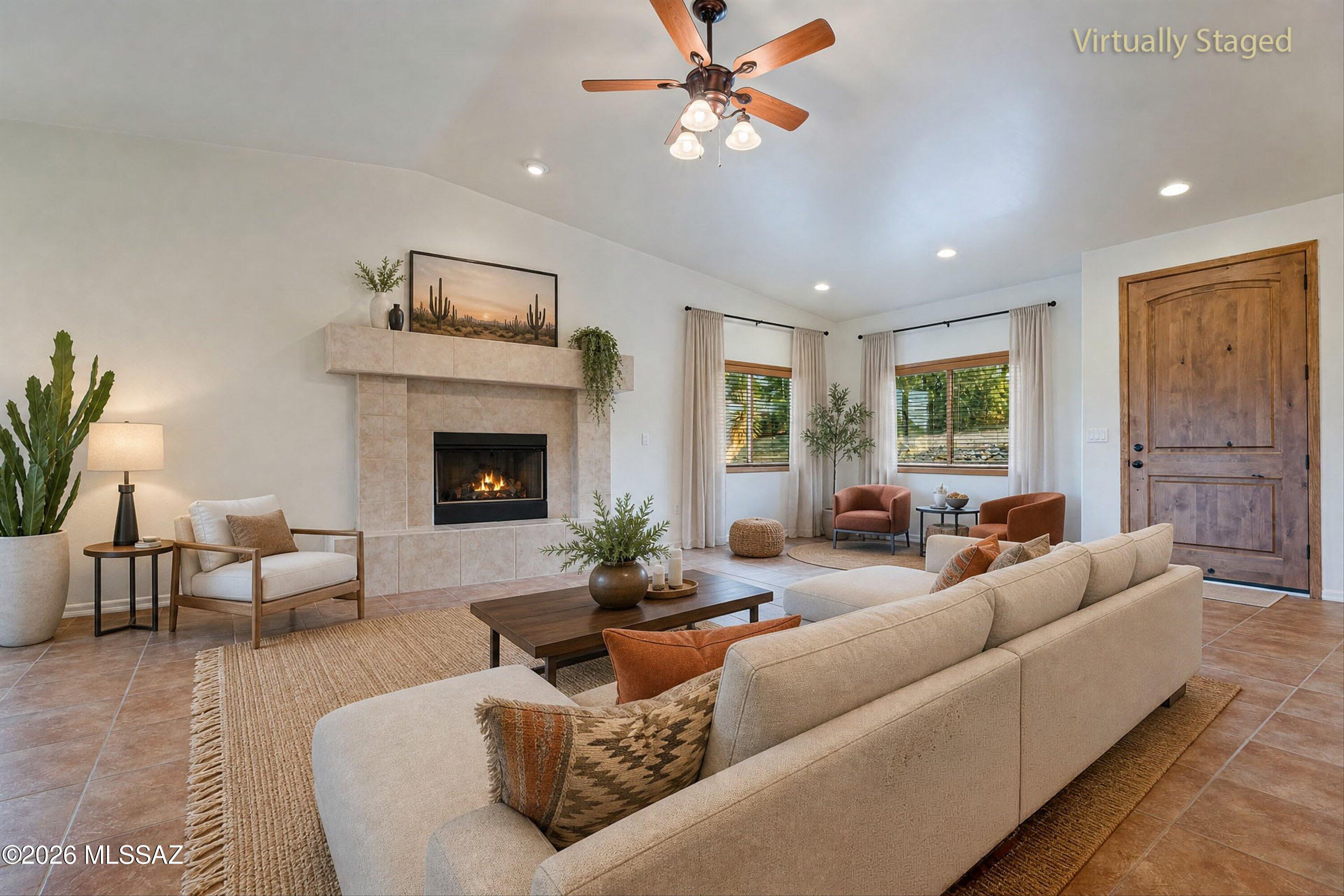 240 Sharon Road Vail, AZ 85641 - Photo 12 of 43 Great room with stately gas fireplace, cathedral ceiling & rich solid wood door.