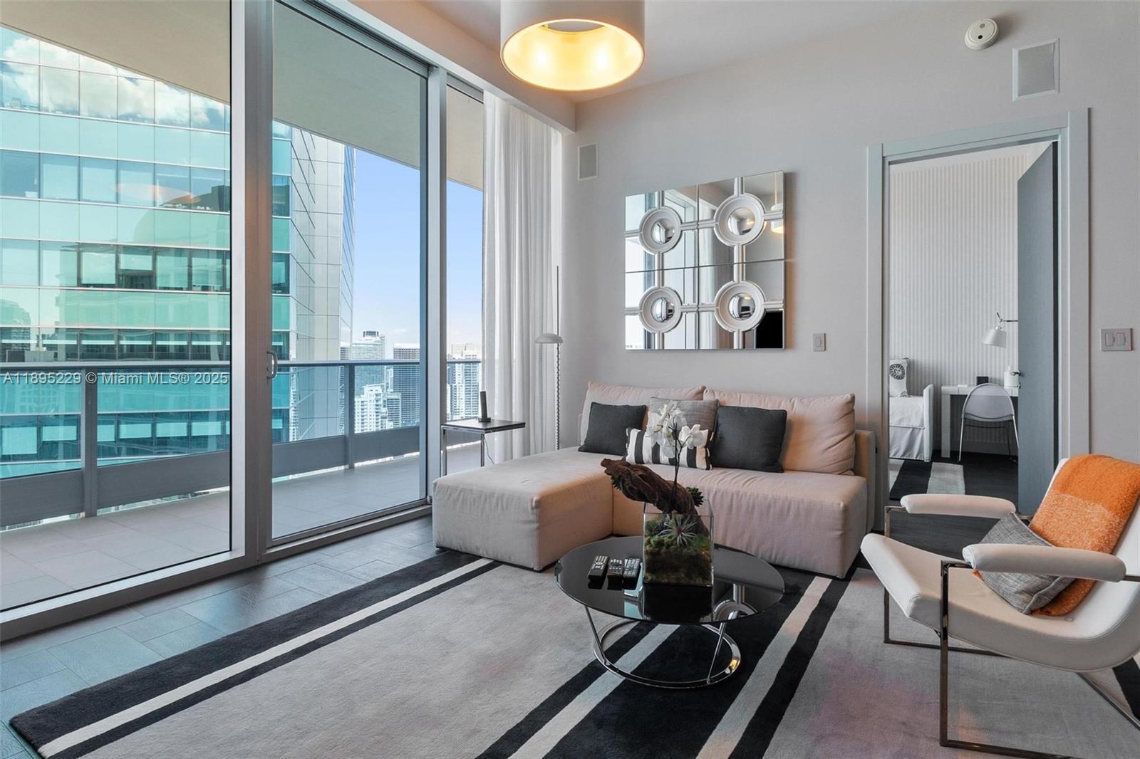 200 Biscayne Blvd Way, Unit 5211 Miami, FL 33131 - Photo 11 of 32 a living room with furniture and a window