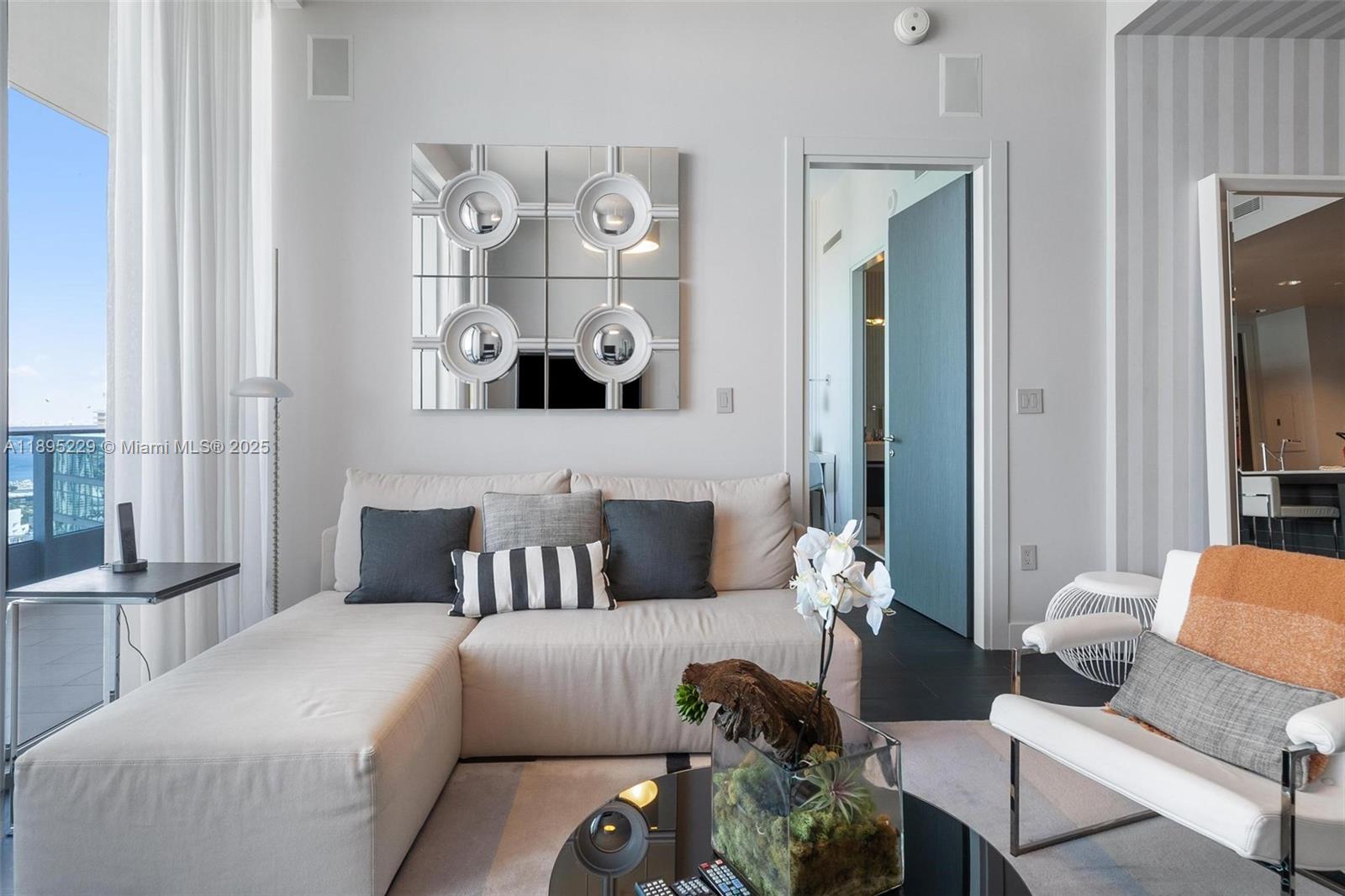 200 Biscayne Blvd Way, Unit 5211 Miami, FL 33131 - Photo 13 of 32 a living room with furniture