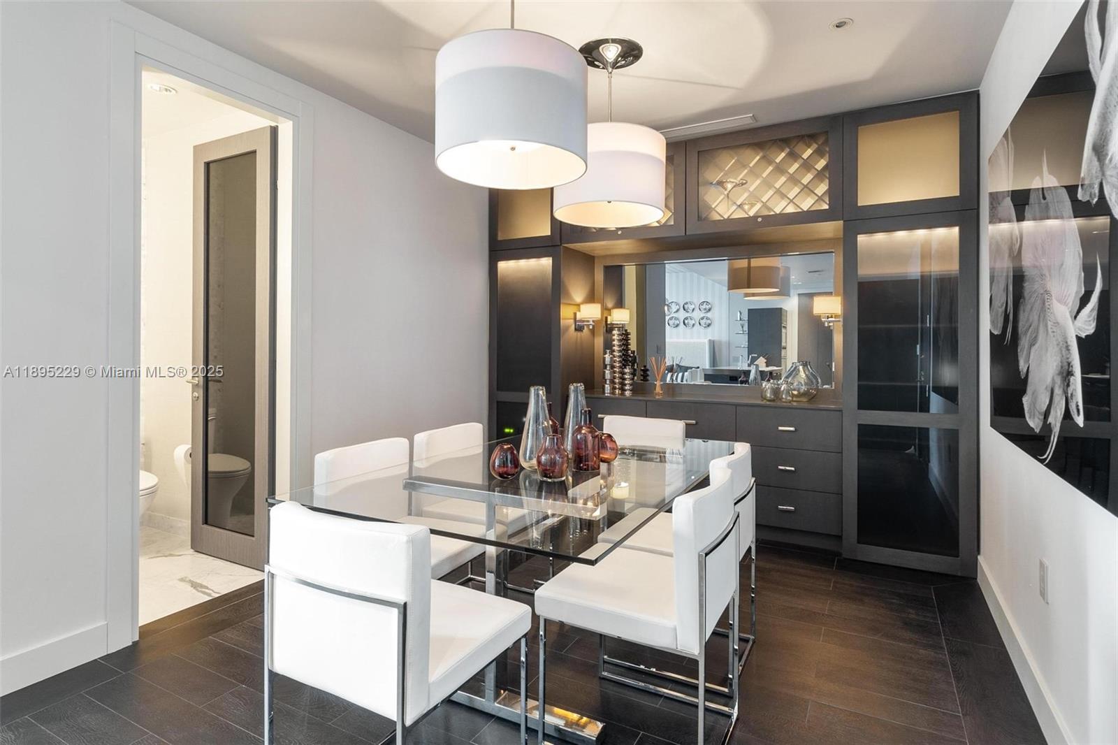 200 Biscayne Blvd Way, Unit 5211 Miami, FL 33131 - Photo 2 of 32 a dining room with furniture and a chandelier