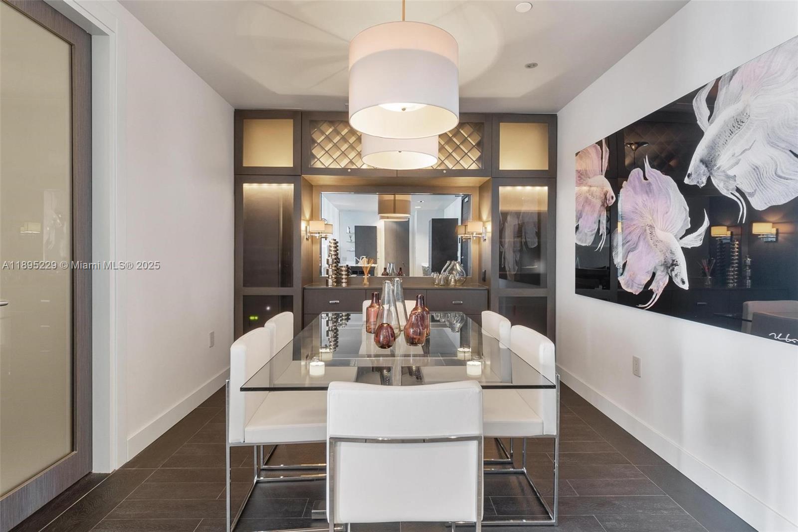 200 Biscayne Blvd Way, Unit 5211 Miami, FL 33131 - Photo 3 of 32 a view of a dining room with furniture and a chandelier