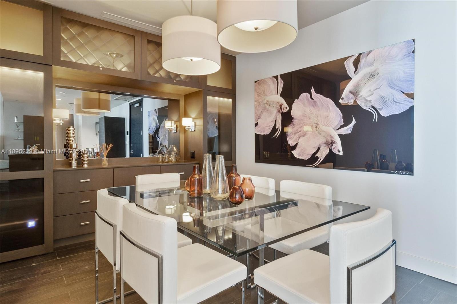 200 Biscayne Blvd Way, Unit 5211 Miami, FL 33131 - Photo 4 of 32 a dining room with furniture and chandelier