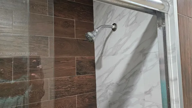 a bathroom with a toilet a sink and a mirror