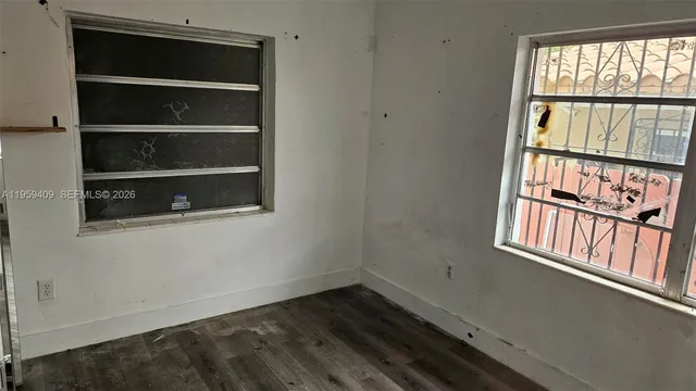 a bathroom with a shower and a window