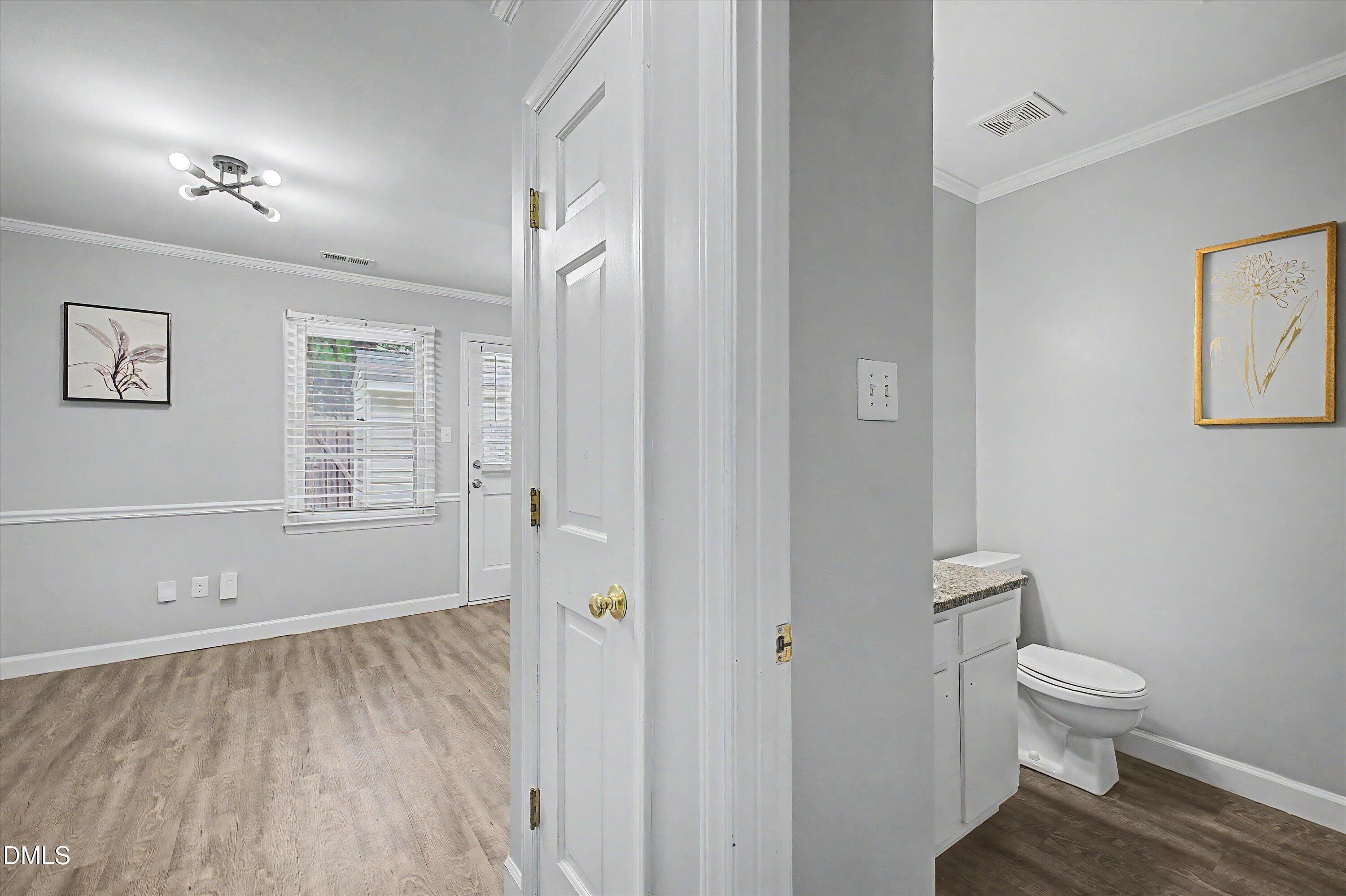 5519 Hamstead Crossing Raleigh, NC 27612 - Photo 8 of 33 a bathroom with a toilet and a shower